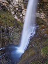 Diesbach waterfall in autumn-colored surroundings, Linthal, Klausenpass, Canton of Glarus,
