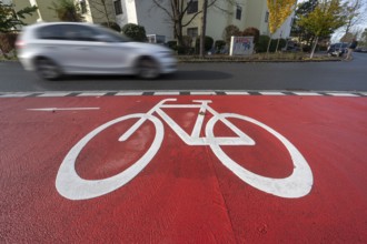 Car passing by the marked bicycle path, Röthebach, Mittelfranken, Bavaria, Germany