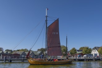 Zeesboot, former historic fishing boat in the port of Ahrenshoop, blue sky, Darß,