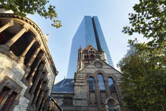 Trinity Church in front of glass façade, John Hancock Tower, various architectural styles on Copley
