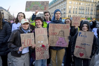 Activists from Fridays For Future holding cardboard signs at Fridays for Future rally on the tenth