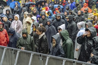 Open air festival audience in rain, Orange Blossom Special Festival, Beverungen, Germany