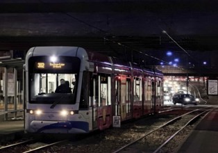 Bogestra tram line 302 at Ernst-Kuzorra-Platz der Kurt-Schumacher-Straße in the evening,