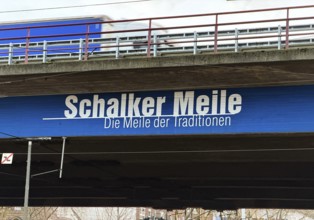 Schalker Meile logo on the A42 motorway bridge with blue and white truck, Gelsenkirchen, North