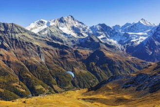Paragliders flying against the backdrop of the Valais Alps, Val d'Anniviers, Canton of Valais,