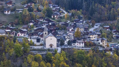 The mountain village of Vissoie with the Sainte Euphemie church at dawn, Val d'Anniviers, Valais
