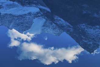 Mountain peaks are reflected in Lac de Chateaupre, Val d'Anniviers, Valais Alps, Canton of Valais,