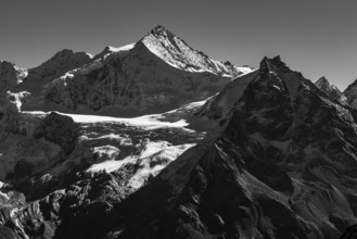 The snow-capped peaks of the Zinalrothorn and Besso mountains, black and white photo, Val