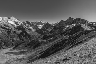Snow-capped peaks in Val d'Anniviers, view from Corne de Sorebois mountain peak, black and white