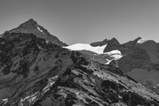 Snowy peaks of the Garde de Bordon and Dent d'Herens mountains, black and white photo, Val