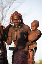 Portrait, Himba woman with baby, traditional clothing, Kaokoveld, Kunene, Namibia