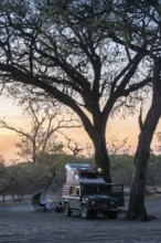 Campground with off-road car and roof tent, Savuti, Chobe National Park, Botswana