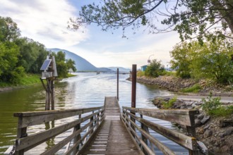 Wooden pier with solar powered navigation light extending into shuswap lake in salmon arm, british