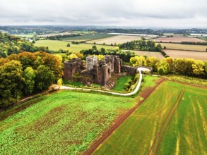 Autumn Colours over ruins of Goodrich Castle and River Wye from a drone, Goodrich, Herefordshire,