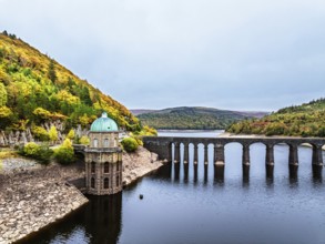 Autumn over Garreg Ddu Dam from a drone, Elan Valley, Caban-Coch Reservoir, Rhayader, Wales, UK