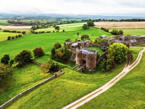 Autumn Colours over ruins of Pembridge Castle or Newland Castle from a drone, Herefordshire,