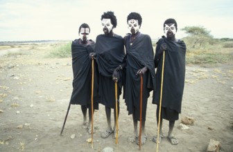 Maasai boys with white painted faces on the occasion of their initiation, Ngorongoro Crater,