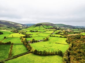 Autumn colours of Farms over River Wye and Road A470 from a drone, Llanidloes, Powys,