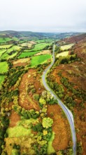 Autumn colours of Farms over River Wye and Road A470 from a drone, Llanidloes, Powys,