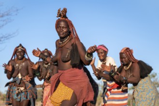 Himba woman dancing, traditional Himba village, Kaokoveld, Kunene, Namibia