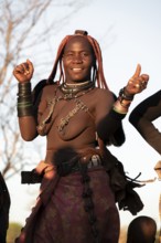 Himba woman dancing, traditional Himba village, Kaokoveld, Kunene, Namibia