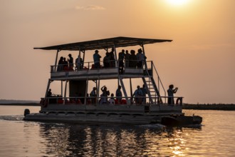 Tourist safari boat in Chobe River, Chobe Waterfront, Ihaha, Chobe National Park, Botswana