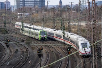 ICE train and S-Bahn on the route east, in front of Essen Central Station, regional transport North