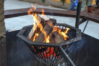 Wood fire at the historic Christmas market on Neustädter church square, Erlangen, Middle Franconia,