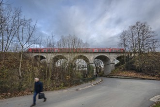 Regional train travels over the historic stone railway viaduct, built in 1876, Lauf an der Pegnitz,