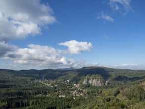 Mountain landscape with forest, rocks and village, view of Oybin, Zittau Mountains, Saxony, Germany