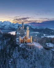Snowy landscape around Neuschwanstein Castle in evening light, Schwangau near Füssen, Ostallgäu,