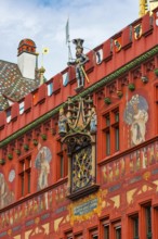 Exterior view with a magnificent clock at the Red Town Hall, Market Square, Basel