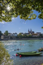 The Rhine with rowing boats in the sunshine in the late afternoon, Basel