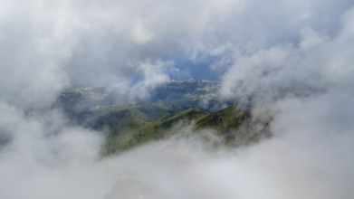 Fog clears, view of the valley from Pico Ruivo, hiking trail PR 1, 2, Madeira, Portugal