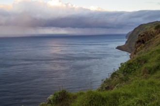 Sunset, rainbow over sea, at Farol da Ponta do Pargo lighthouse, west coast, Madeira, Portugal