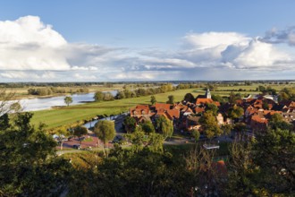View of half-timbered houses and church in Hitzacker, banks of the Elbe, river landscape,