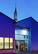 The Johanniszentrum with the top of St. John's Church in the evening, Witten, Ruhr area, Germany