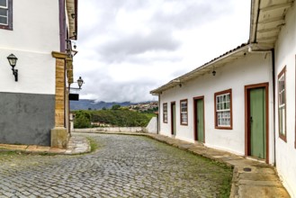 A winding street between historic houses in the city of Ouro Preto, Ouro Preto, Minas Gerais,
