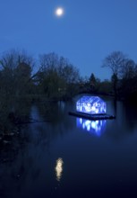 The river Lippe with the artwork Arche by Christoph Hildebrand at night with full moon, Lippstadt