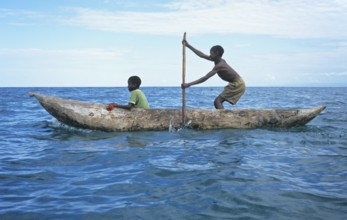 Two boys in a dugout on Lake Malawi, Malawi, Africa, July 2000, vintage, retro, old, historic