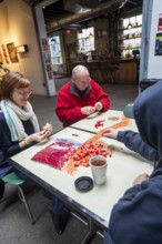 Detroit, Michigan - Volunteers with the Detroit Peoples Assembly put together whistle kits. The