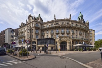 Historic building, former hotel palace hotel, barrier bollard, street, round façade with windows,