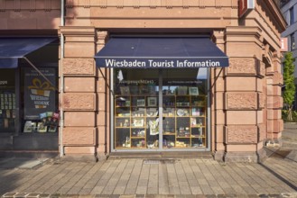Wiesbaden tourist information, historic commercial building, awnings, shop windows, tourist