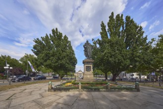 Kaiser Friedrich memorial, square, flower bed, lantern, spa hotel, advertising flag on flagpoles,