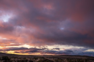 Cloudy sky at sunset, Tama Lake Walk (Tama Lakes Track) . Tongariro National Park, North Island,
