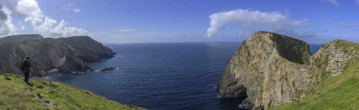 View of blue sea and cliffs with rock gate from Portacloy Loop Cliff Walk, Muingnabo, County Mayo,