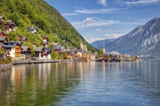 A, Hallstatt, hdr, A picturesque lakeside village with colorful houses against a mountain backdrop
