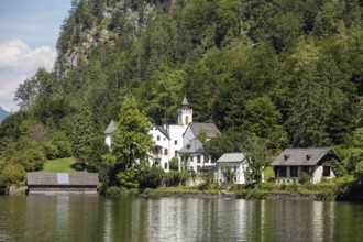 A, Hallstatt, An estate with several buildings on the shores of a lake, surrounded by trees,