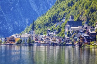 A, Hallstatt, hdr, A picturesque lakeside village with colorful views and steep mountain faces,