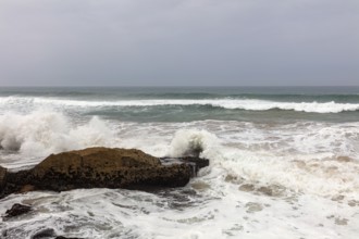 Waves beat against the rocky coast